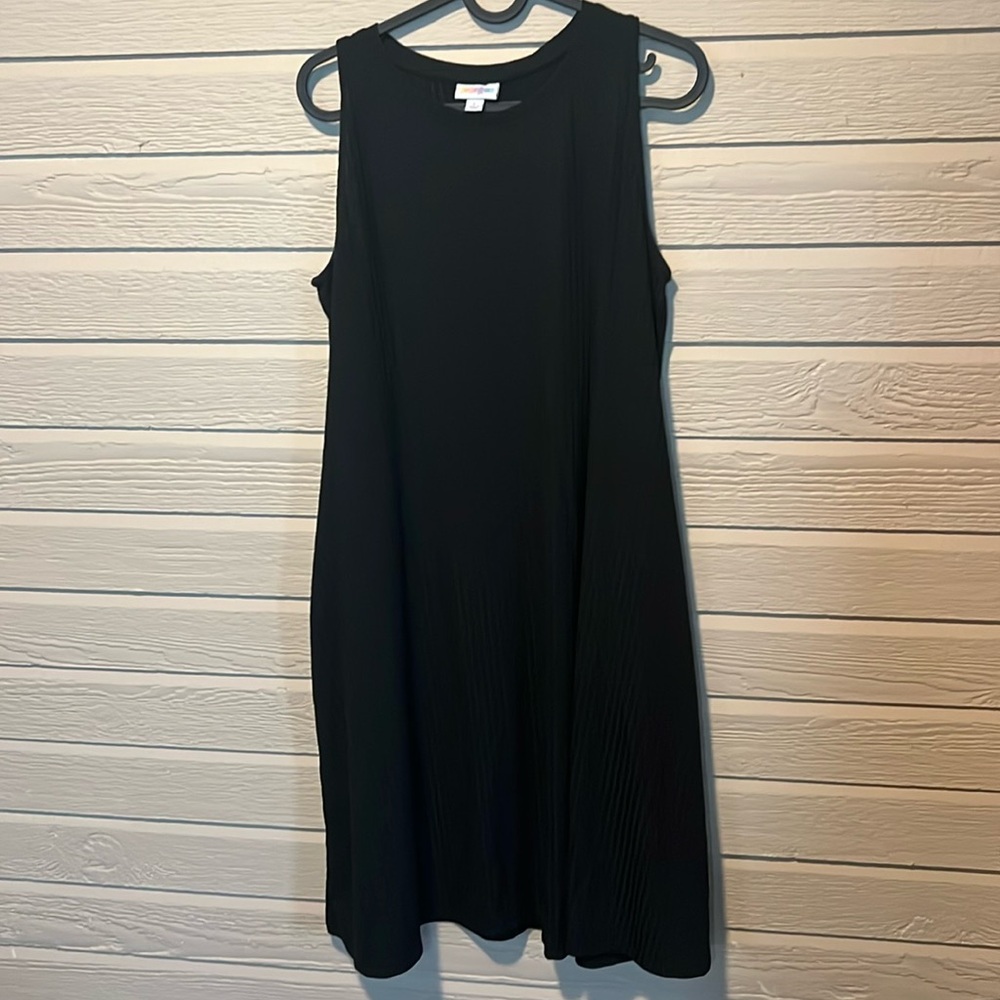 Never worn. Women’s L LulaRoe Black dress.